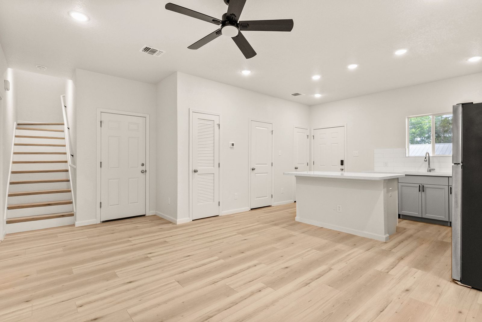 Open living area and staircase, 711 N Mittman St