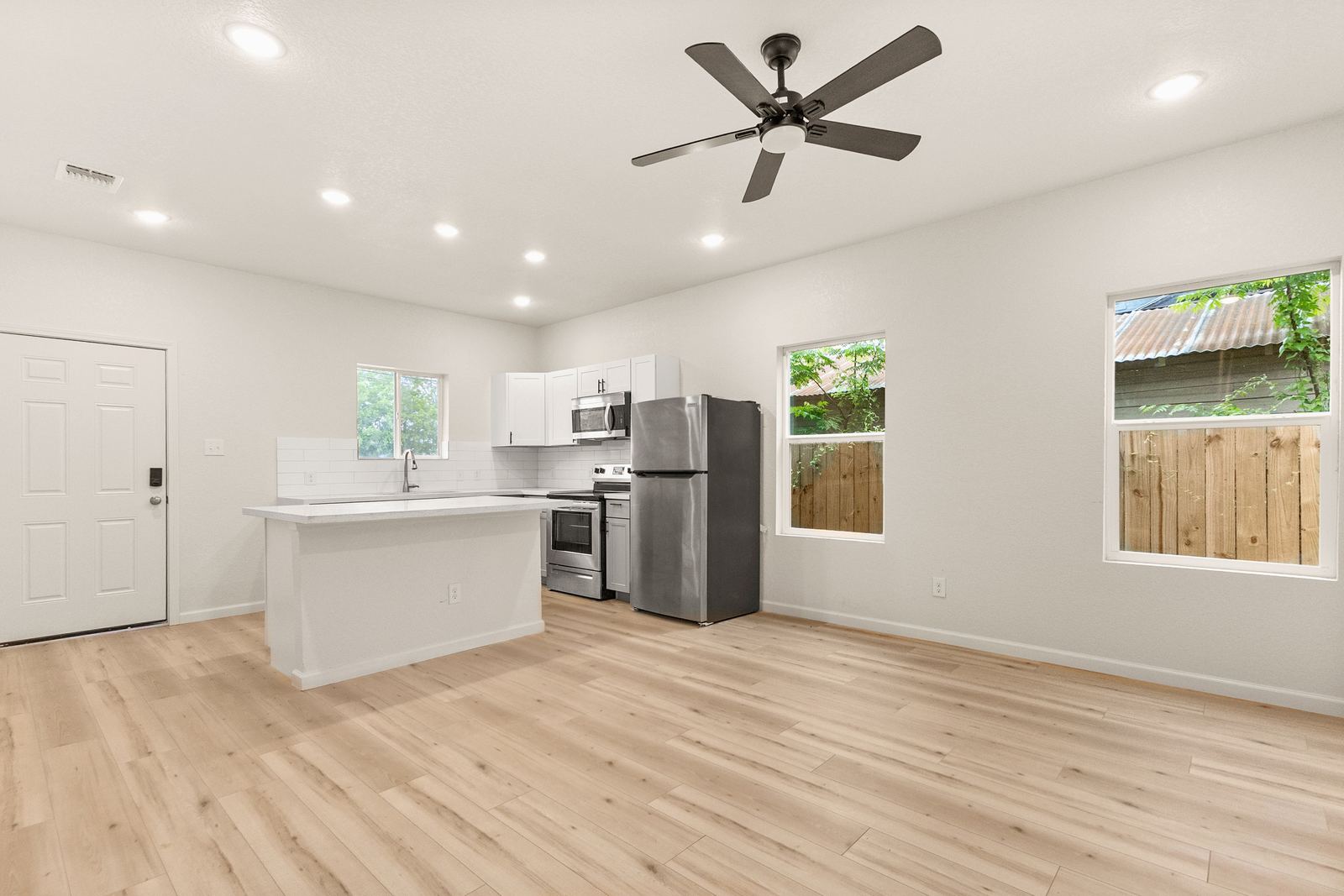 Living room with backyard views, 711 N Mittman St